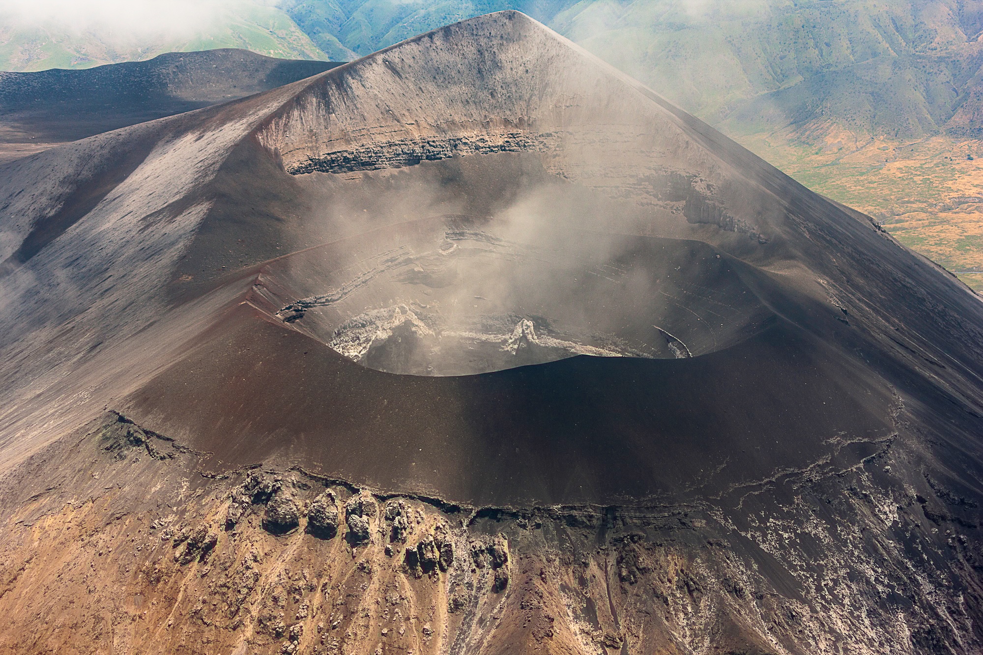 Stunning view into a smoking volcano caldera